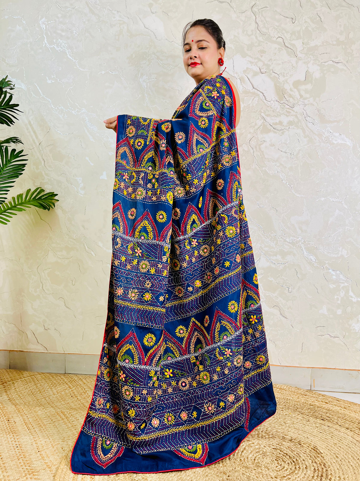Deep indigo Lambani mirror work saree, standing draped pallu view