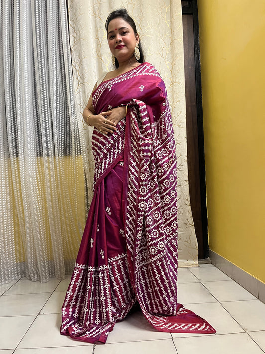 A women wearing Wine red Gujarati Stitch Saree with precise Kutch geometric hand embroidery and mirror work by Desi Aadat