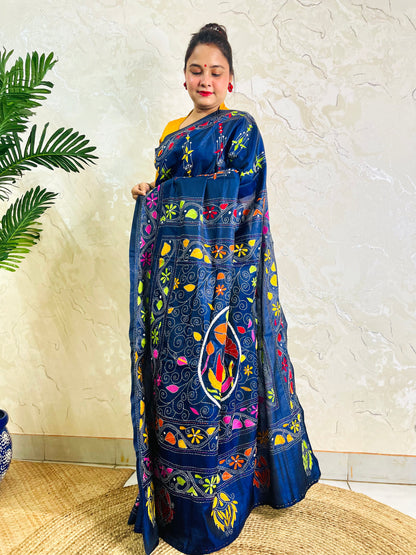 Front standing view of ink blue Bangalore silk saree with Kantha embroidery