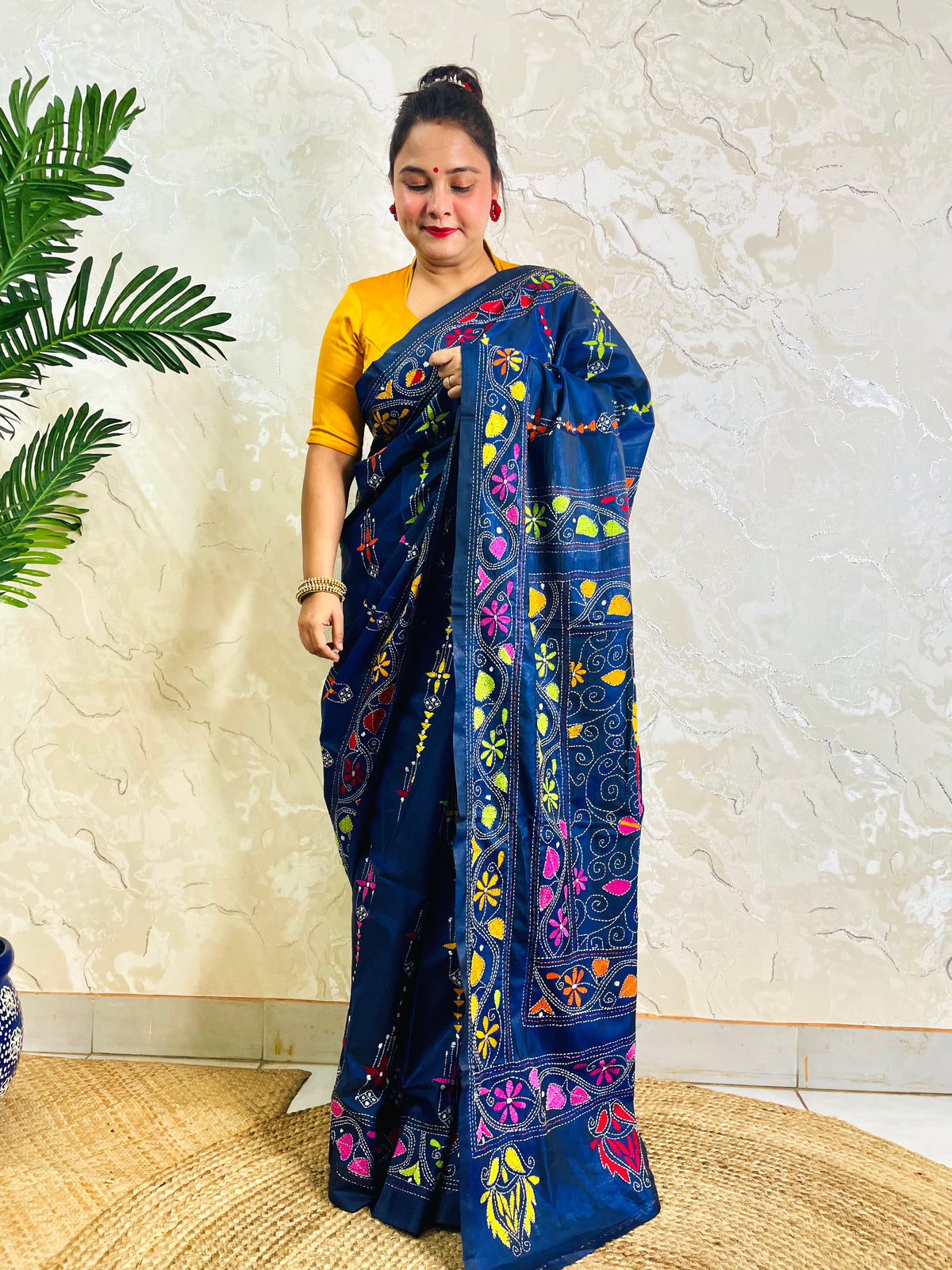 Front standing view of ink blue Bangalore silk saree with Kantha embroidery