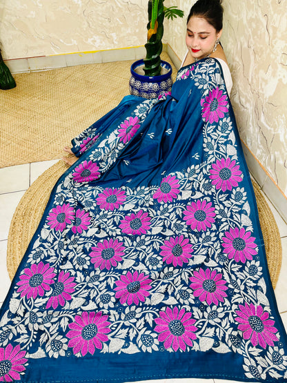 Seated pose in peacock blue Kantha stitch saree with sunflower pallu on Bangalore silk