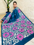 Seated pose in peacock blue Kantha stitch saree with sunflower pallu on Bangalore silk