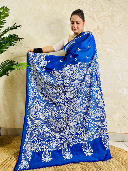 Front standing view of royal blue Kantha saree with branch and leaf pallu and plain body