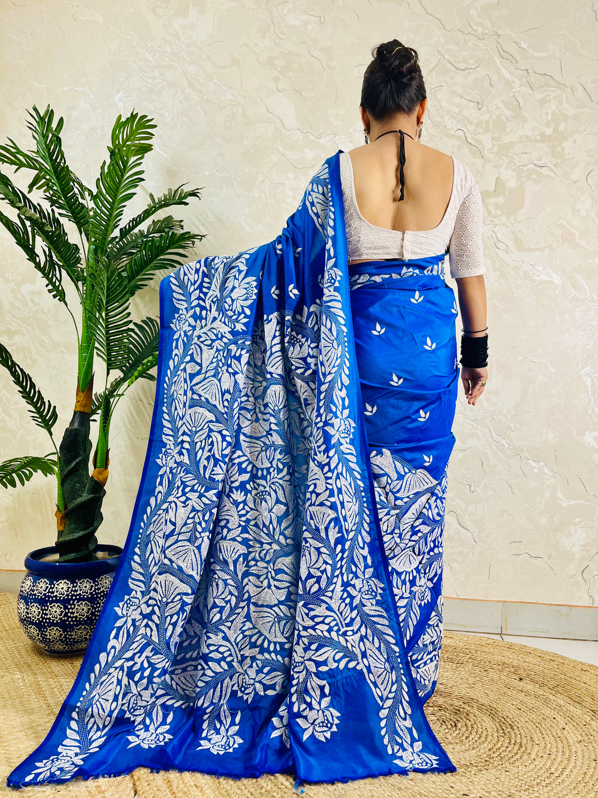 Back view of royal blue Kantha stitch saree with white branch and leaf pallu on Bangalore silk