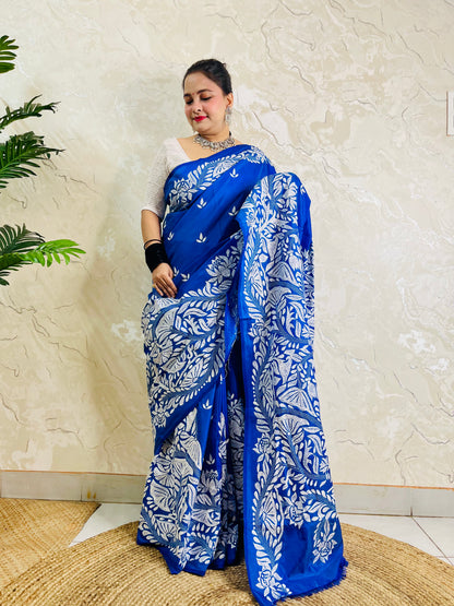 Front standing view of royal blue Kantha saree with branch and leaf pallu and plain body