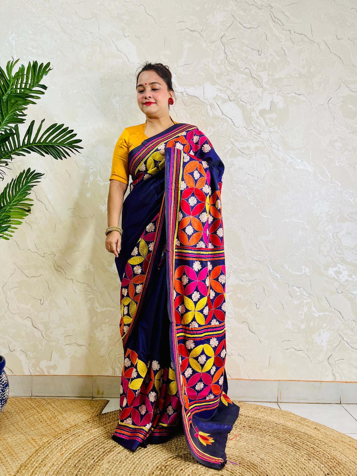 Front standing view of deep indigo Kantha stitch saree with multicolour thread work