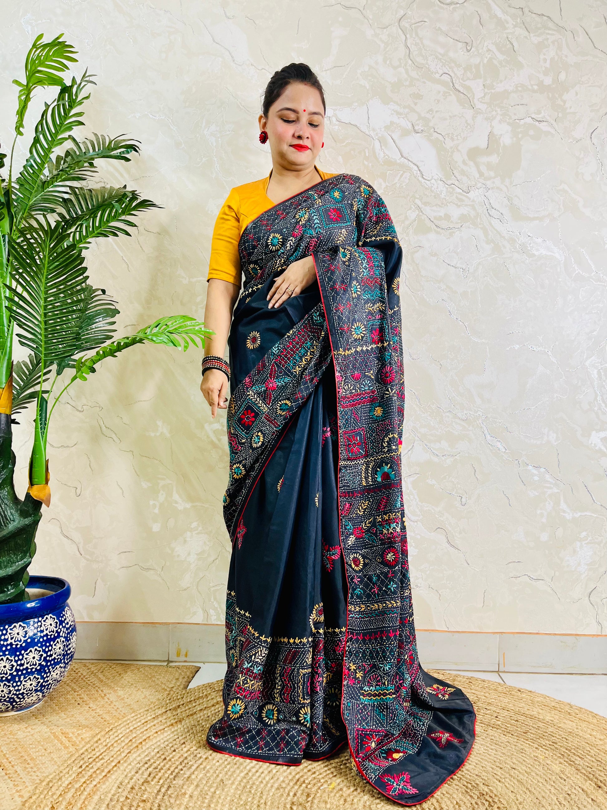Black Lambani hand stitch saree, back pallu draped standing view