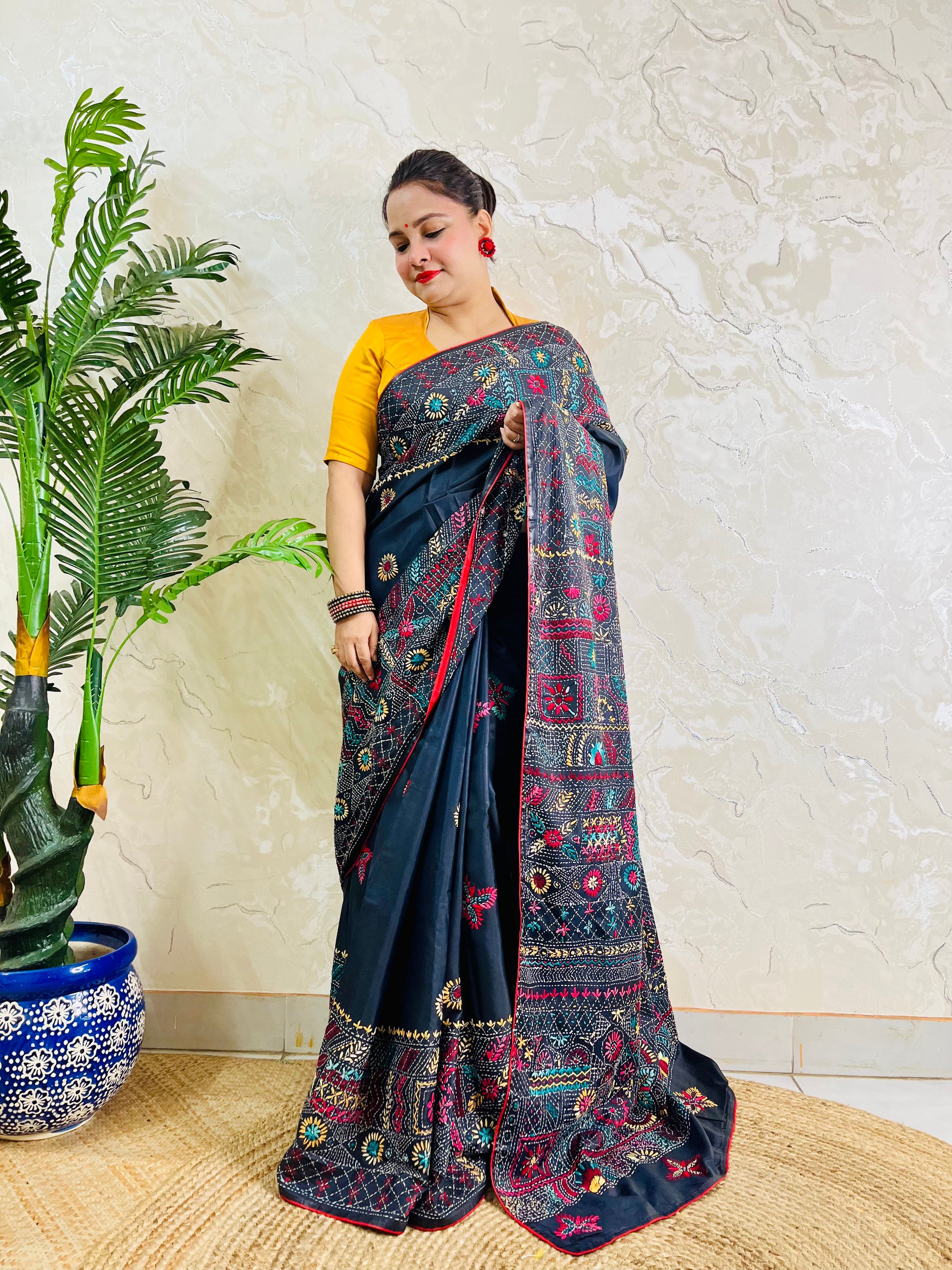 Black Lambani hand stitch saree, back pallu draped standing view