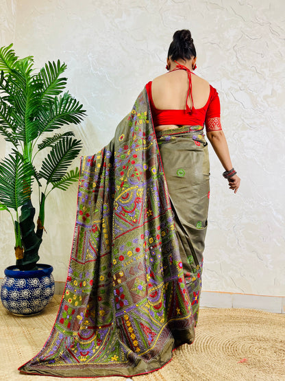 Back standing view of moss green Lambani hand embroidered saree