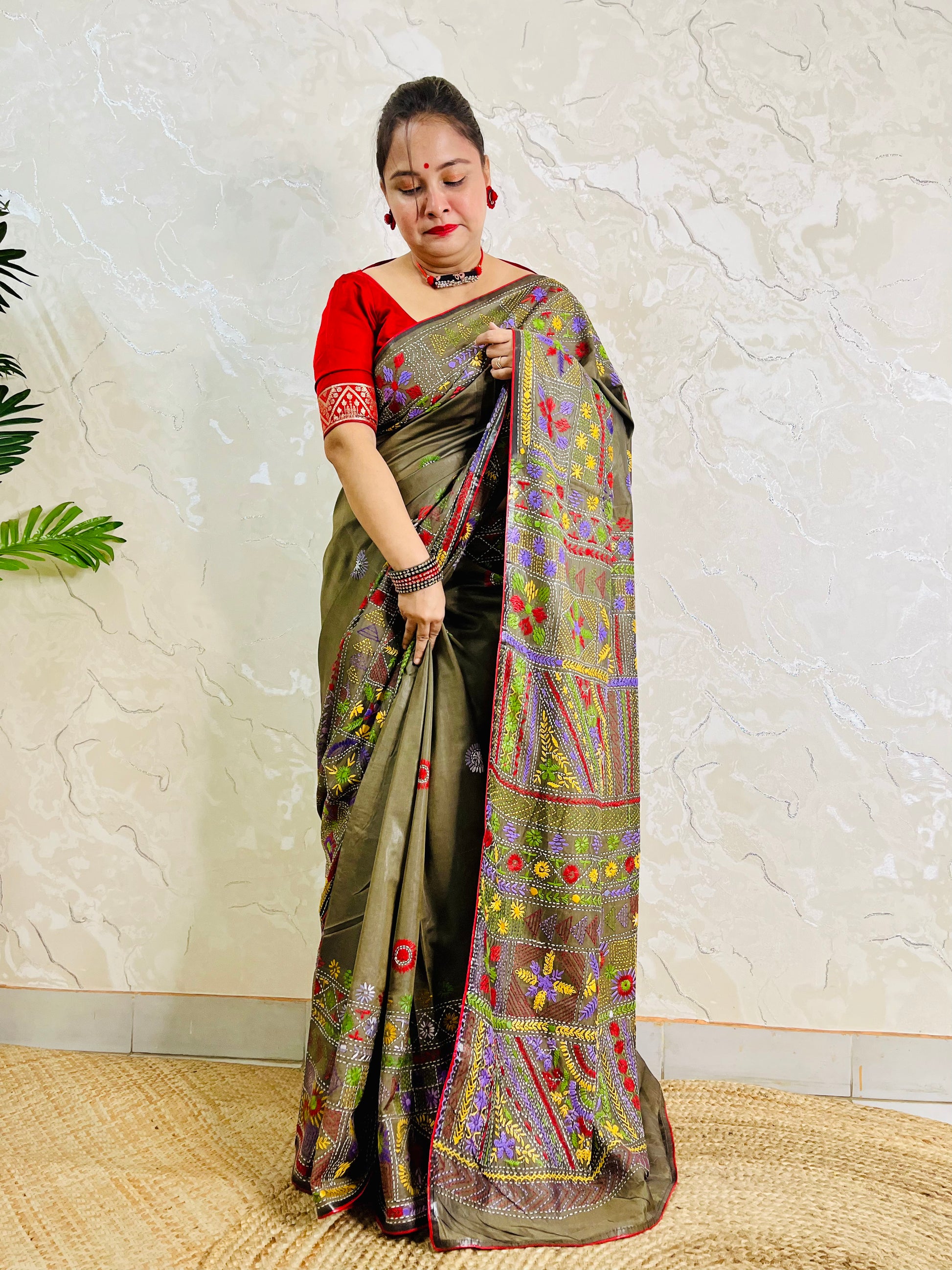 Moss green Lambani hand stitch saree, side standing view with pallu draped