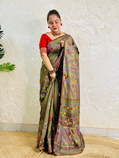 Moss green Lambani hand stitch saree, side standing view with pallu draped