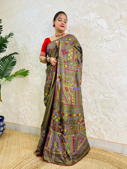 Moss green Lambani hand stitch saree, side standing view with pallu draped