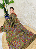 Front seated view of moss green Lambani stitch saree with floral border