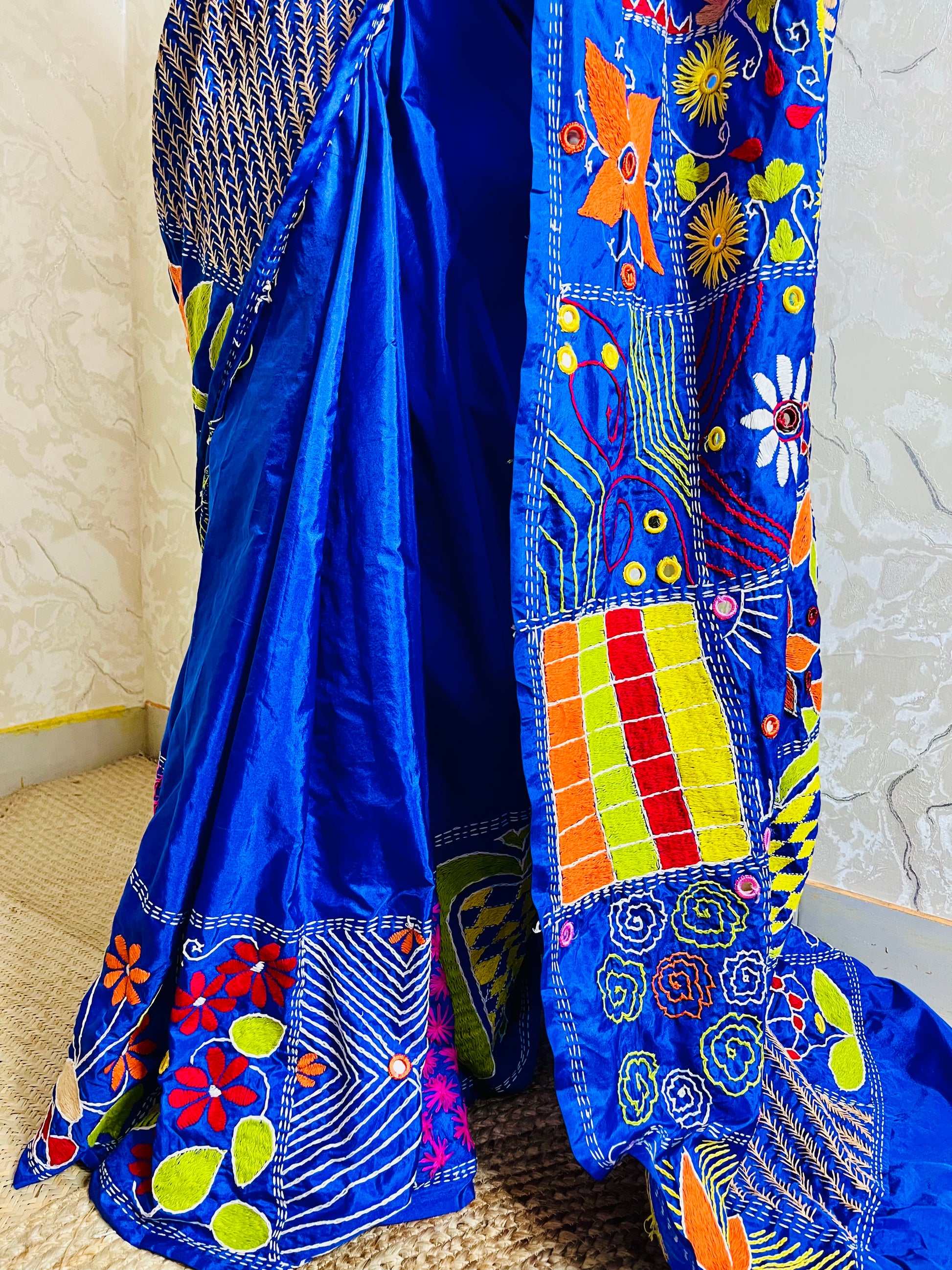 Detailed Lambani embroidery patterns on blue silk saree pallu