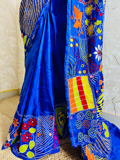 Detailed Lambani embroidery patterns on blue silk saree pallu