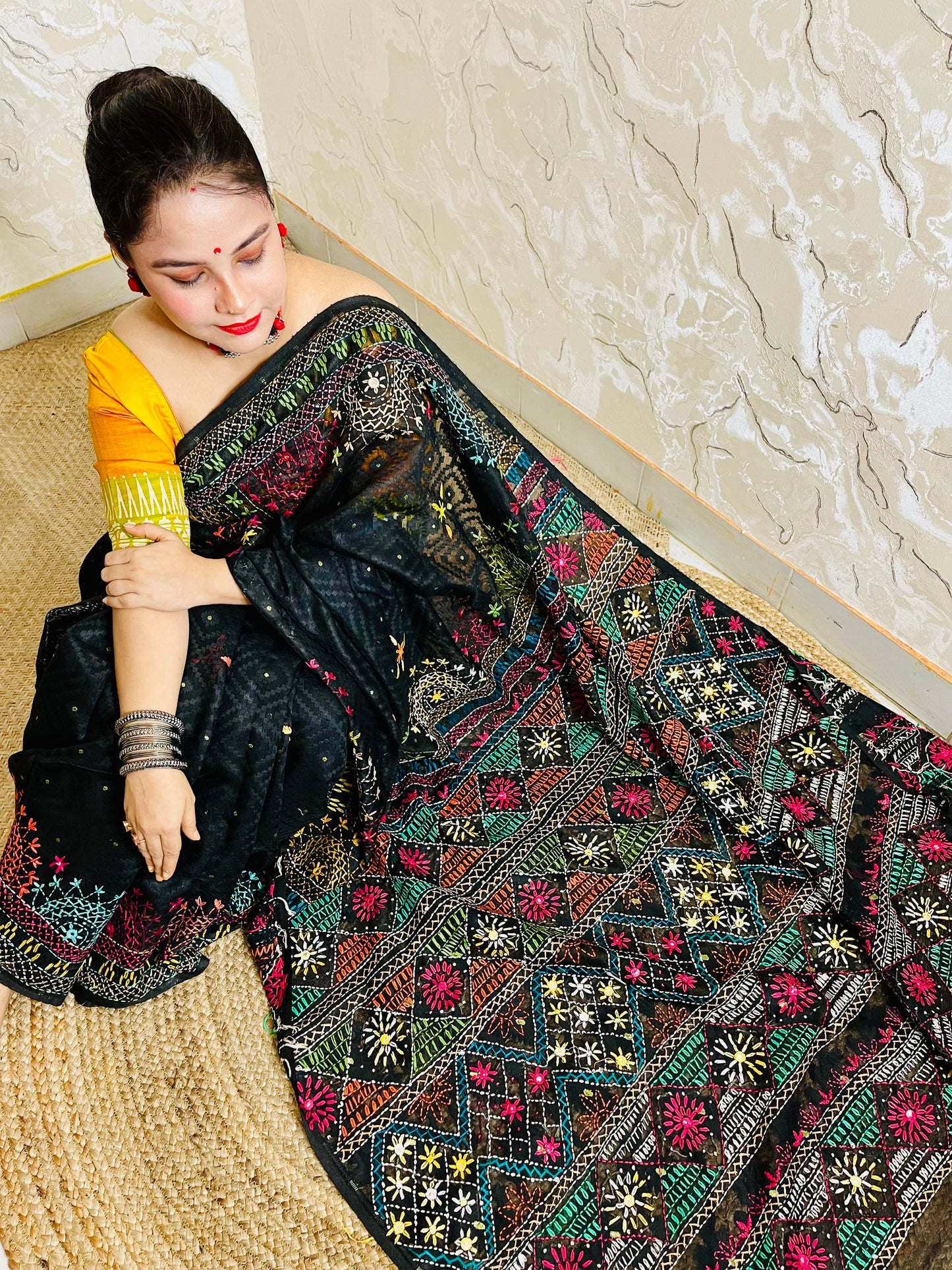 Handcrafted black Jamdani saree with colourful geometric embroidery design