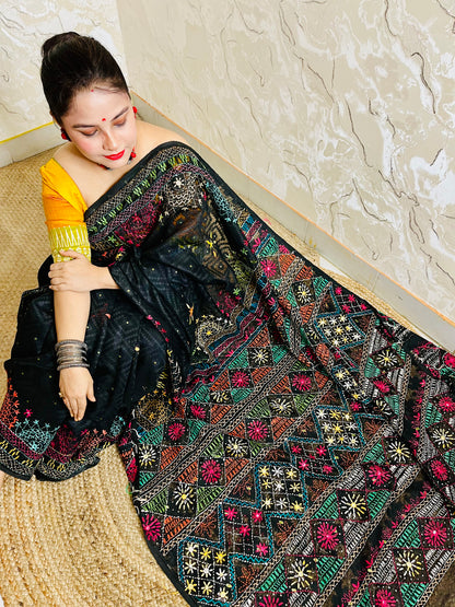 Handcrafted black Jamdani saree with colourful geometric embroidery design