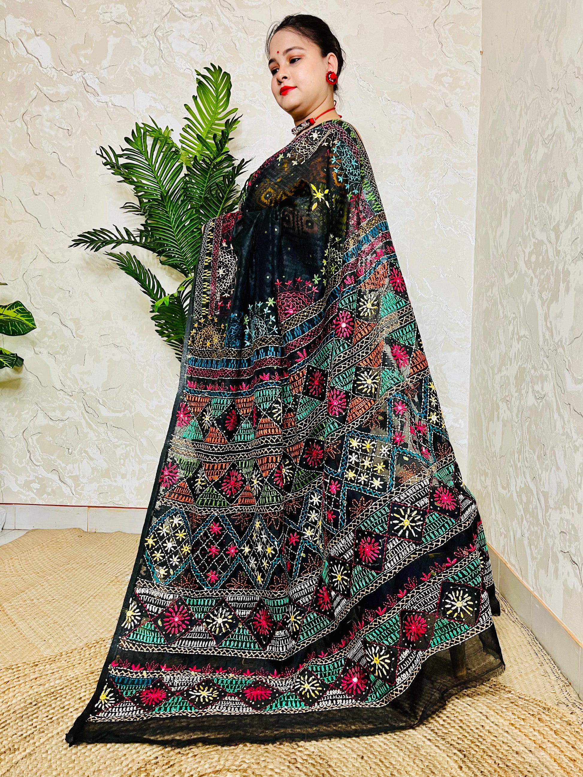 Close up of Lambani embroidery on black cotton Jamdani saree