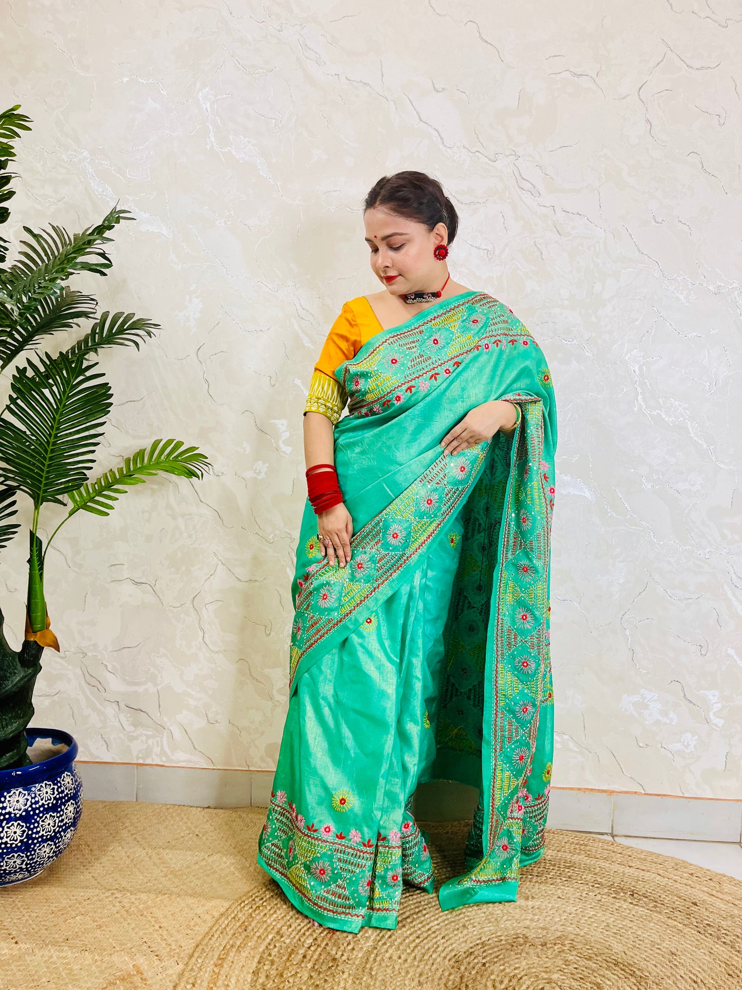 Indian woman styling sea green handcrafted tissue silk saree ethnic look
