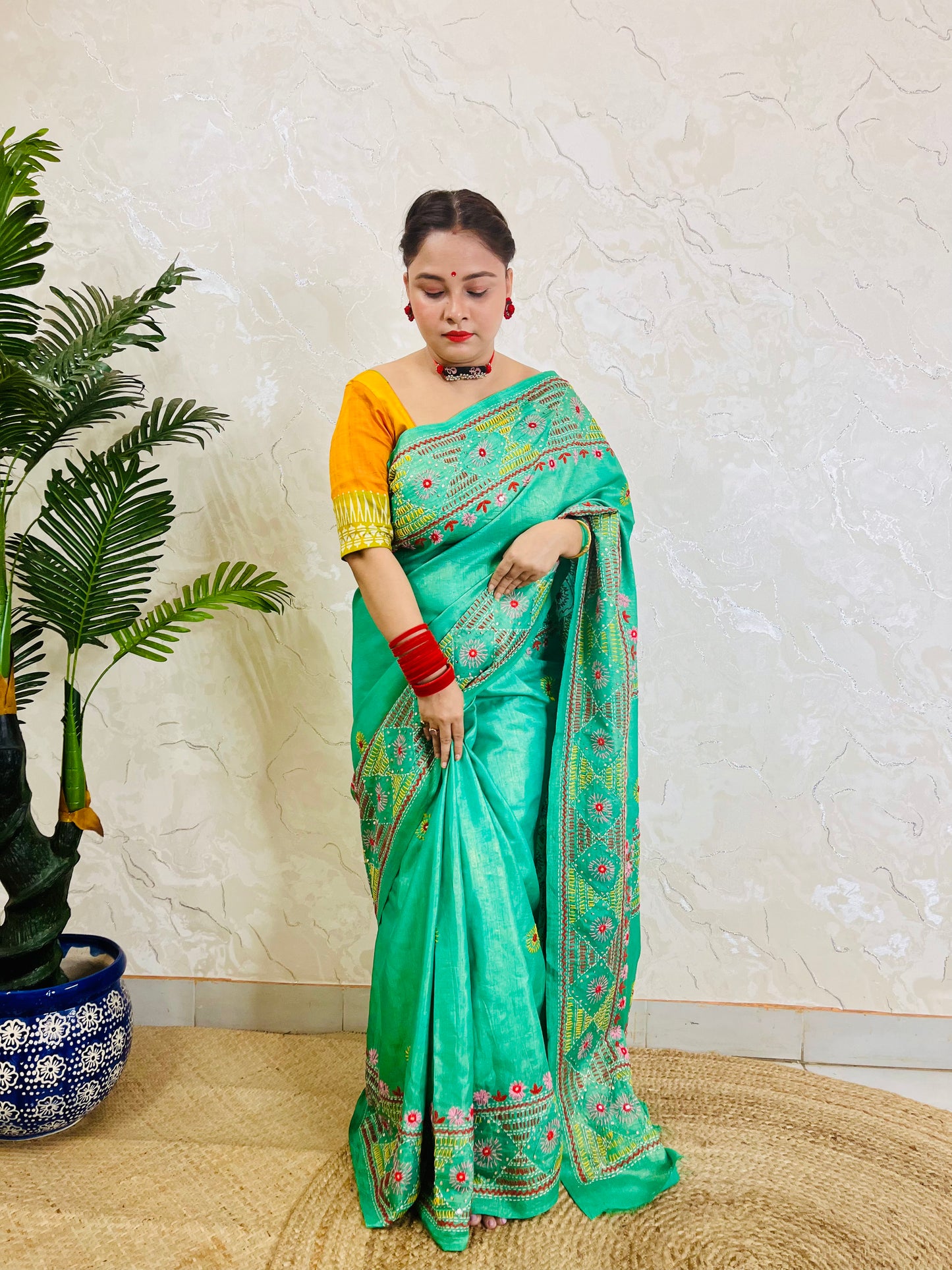 Detailed border design Lambani embroidery on sea green silk saree