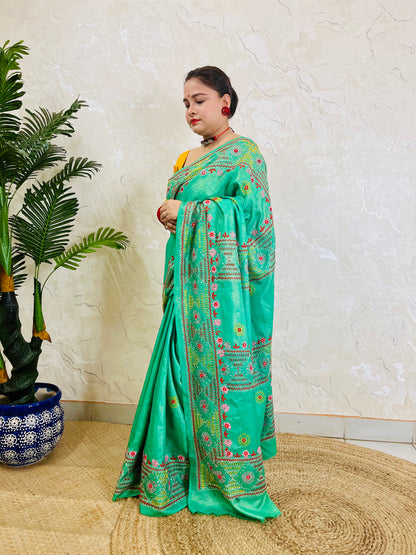 Soft shimmer tissue silk saree sea green with traditional hand embroidery