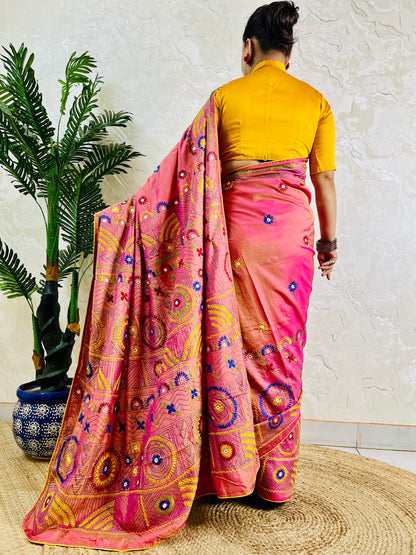 Coral pink Lambani mirror work saree, back standing view
