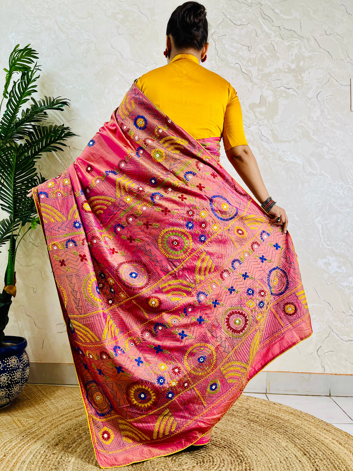 Coral pink Lambani mirror work saree, back standing view
