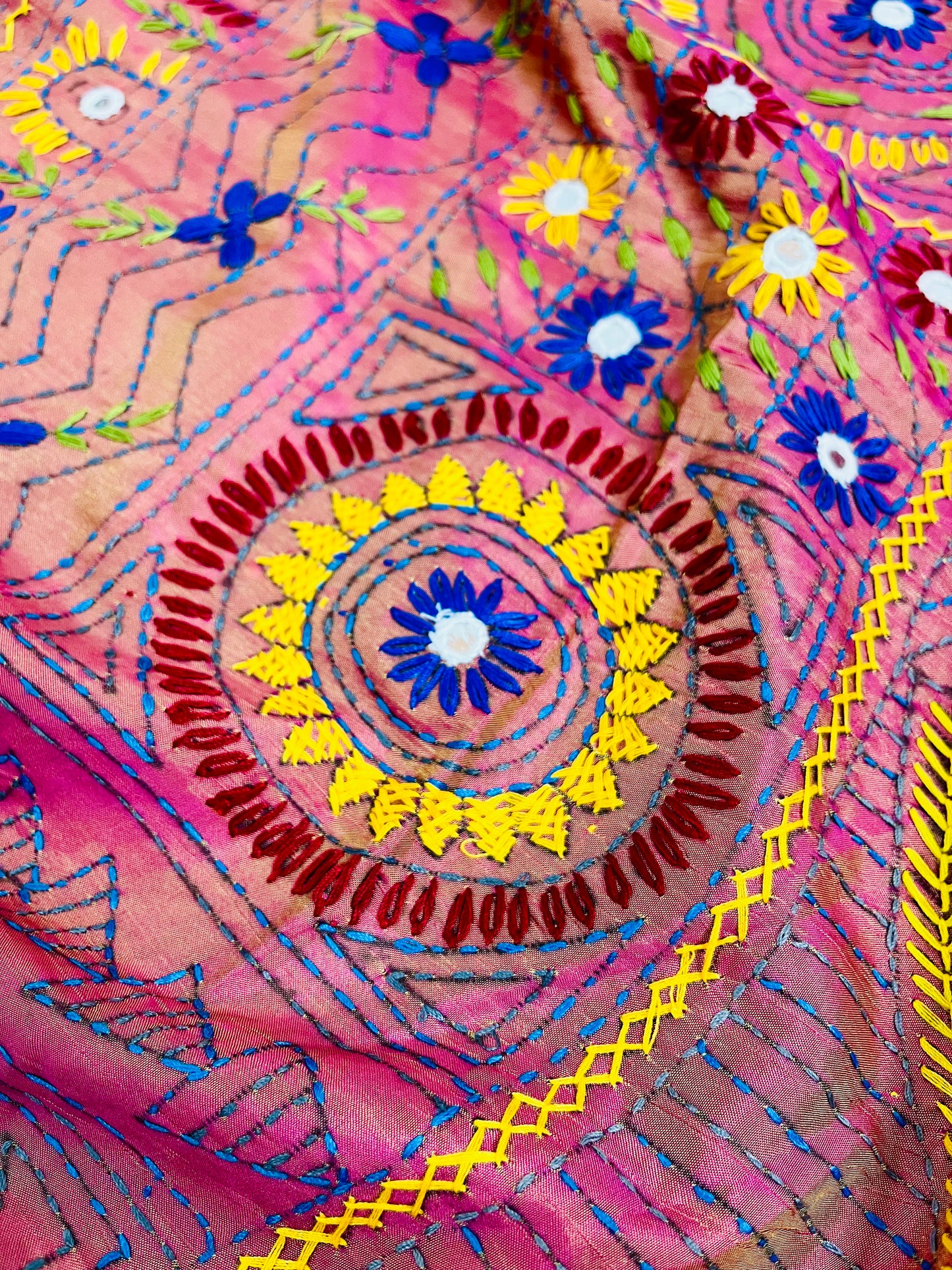Detailed mica mirror work and thread embroidery on coral pink Bangalore silk saree