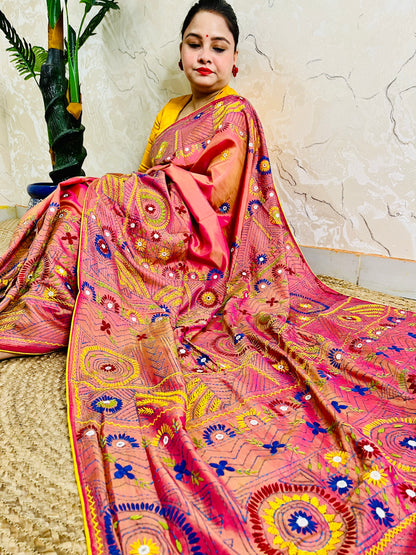 Coral pink Lambani stitch saree with mirror work, full seated drape view