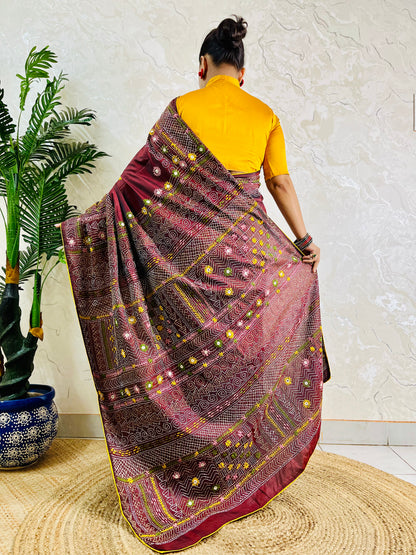 Burgundy Lambani embroidered saree with mirror work, back pallu draped view