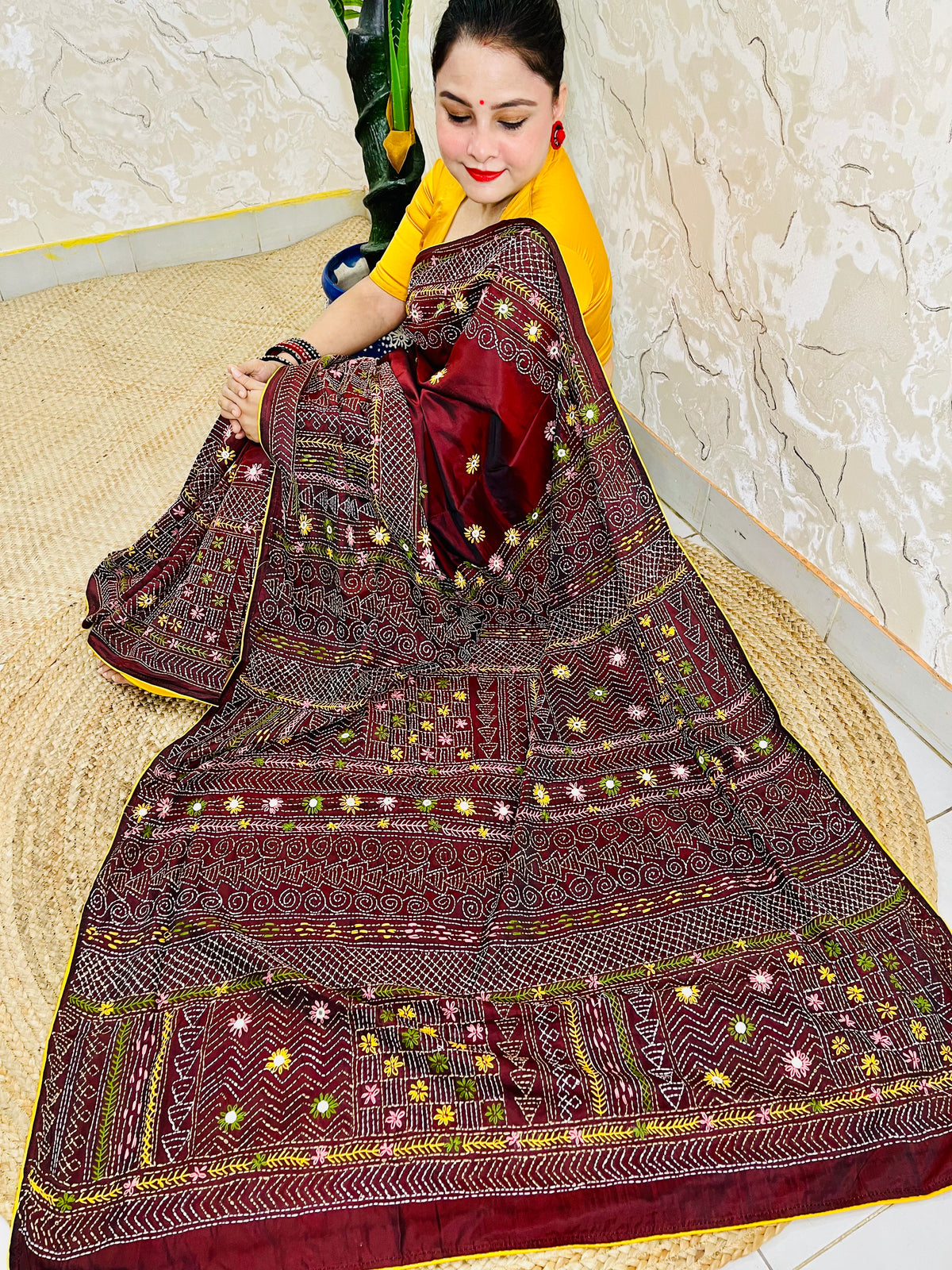 Burgundy Lambani mirror work saree draped, close-up seated view
