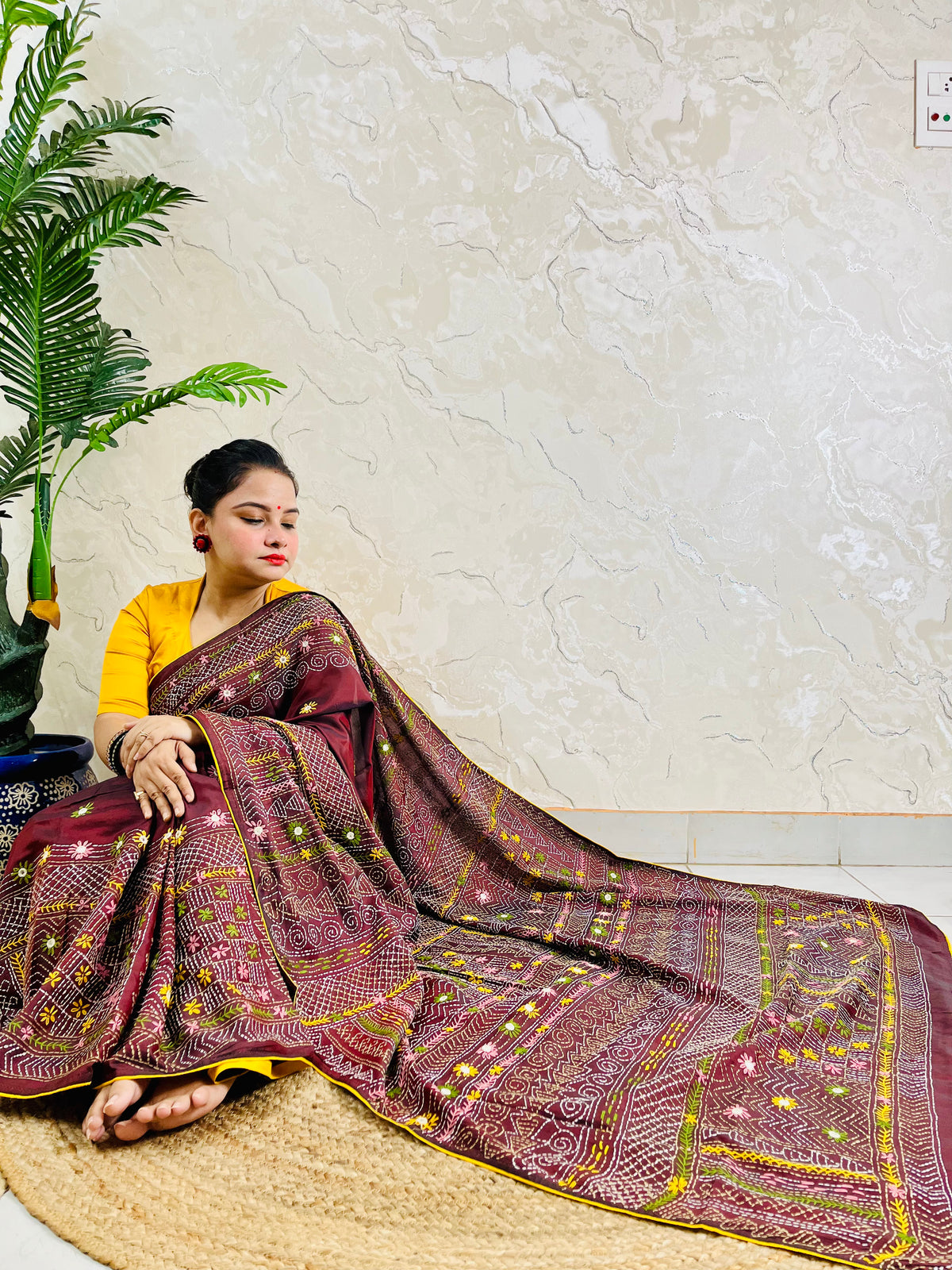 Burgundy Lambani mirror work saree draped, close-up seated view