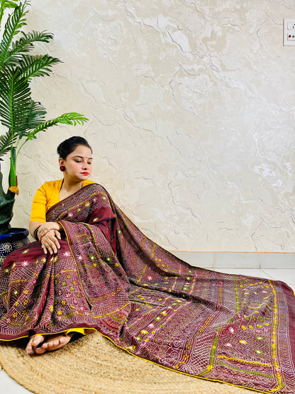 Burgundy Lambani mirror work saree draped, close-up seated view