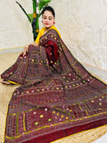 Burgundy Lambani mirror work saree draped, close-up seated view