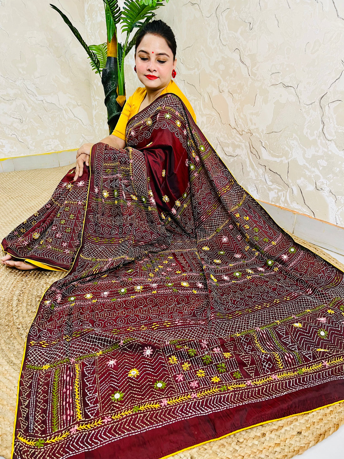 Burgundy Lambani mirror work saree draped, close-up seated view