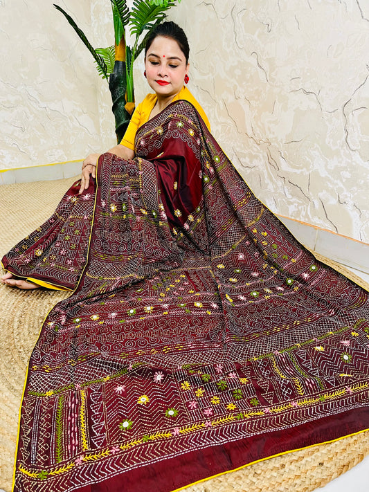 Burgundy Lambani mirror work saree draped, close-up seated view