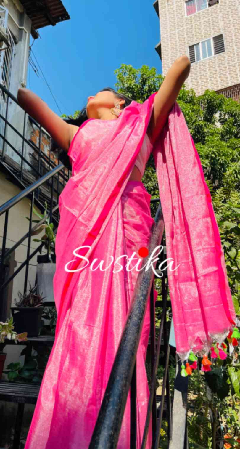 Close-up of silver zari on Pink linen saree fabric