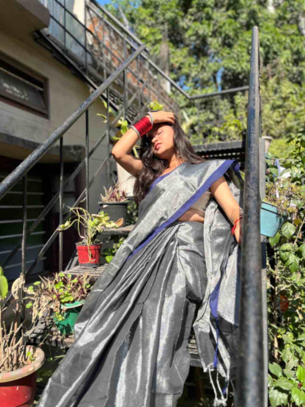 Experience the timeless beauty of a handwoven grey silver linen saree adorned with delicate blue zari, exclusively from Desi Aadat.