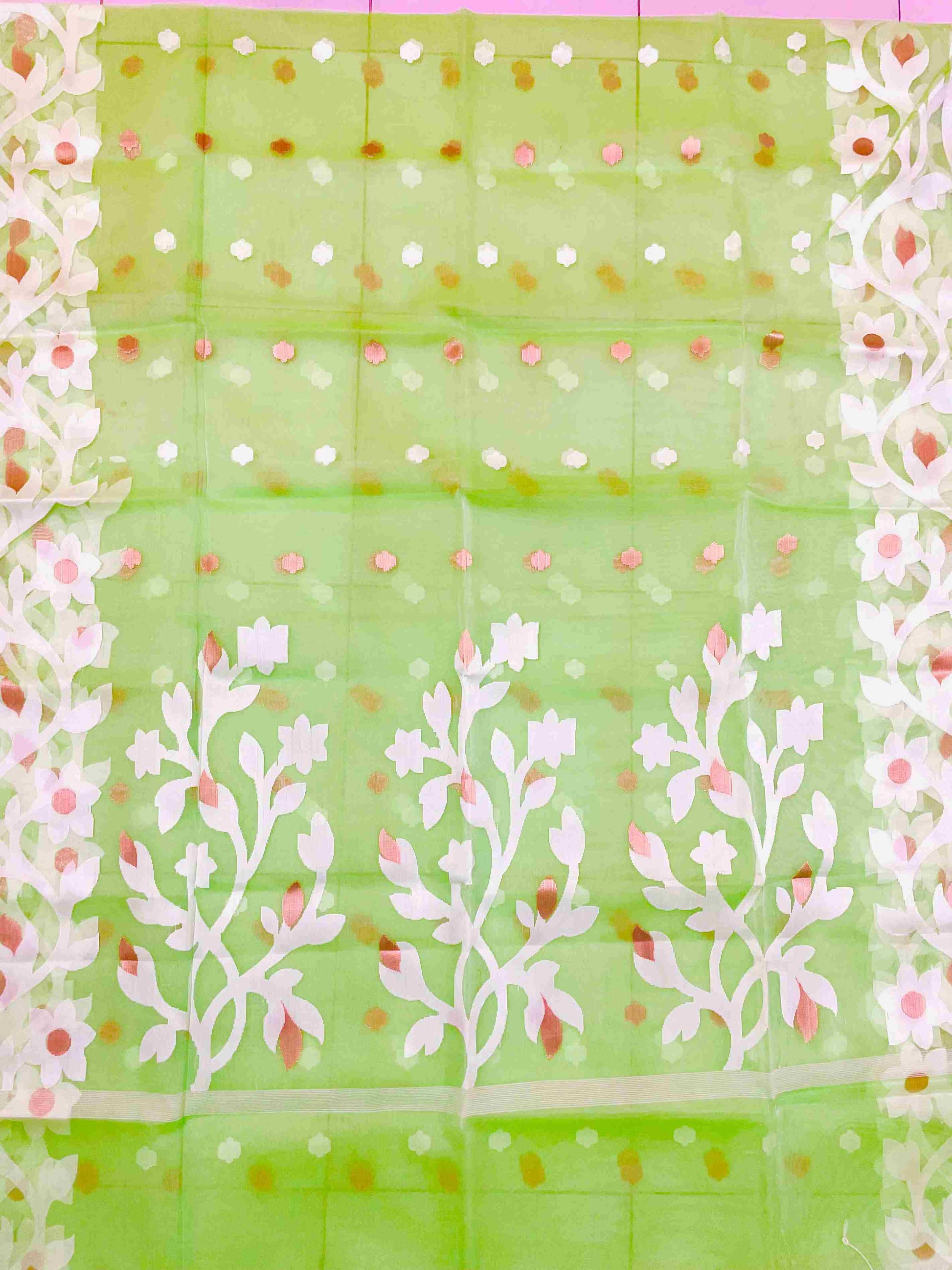 Close-up of Jamdani muslin saree motifs on Banana Leaf Green silk fabric