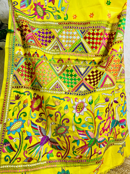 Detailed close-up of the exquisite Nakshi Katha embroidery, highlighting the vivid multi-colored geometric patterns, alongside the large bird and blooming floral motifs