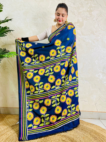 Pallu held open showing rows of hand embroidered sunflowers framed by lime, yellow and pink stripes