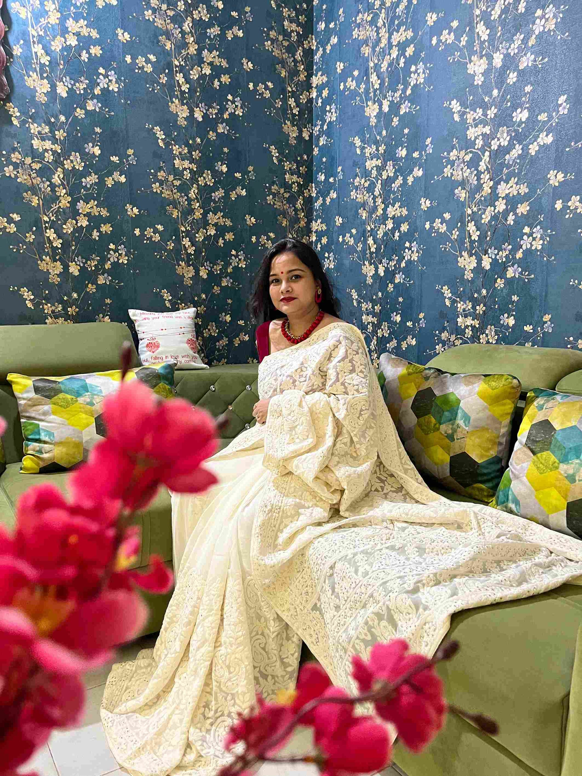 Graceful woman in Off-White georgette saree showcasing Desi Aadat’s Chikankari design