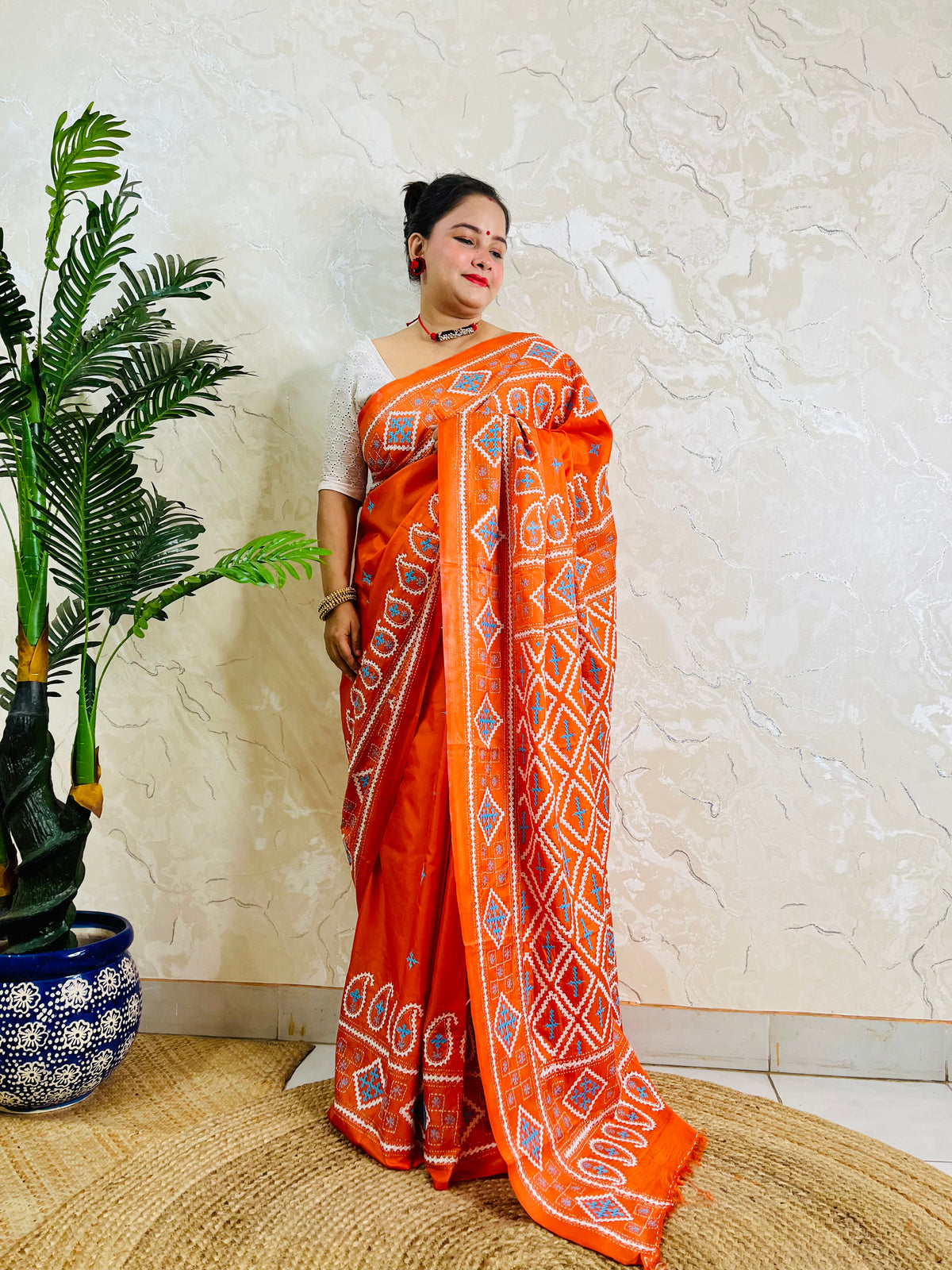 Orange Gujarati stitch saree with diamond lattice Kutch embroidery, full drape