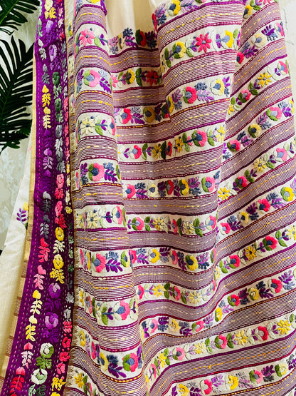Close-up of Parsi Gara hand-embroidered horizontal floral garden stripes in pink, purple, lavender, coral, and yellow with Kardana gold bead detailing on Semi Muga Silk — Desi Aadat