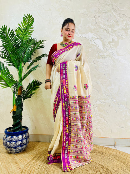 Handwoven Parsi Gara Semi Muga Silk saree with scattered butti florals and deep magenta pink velvet Kardana embroidered border — side standing view, Desi Aadat