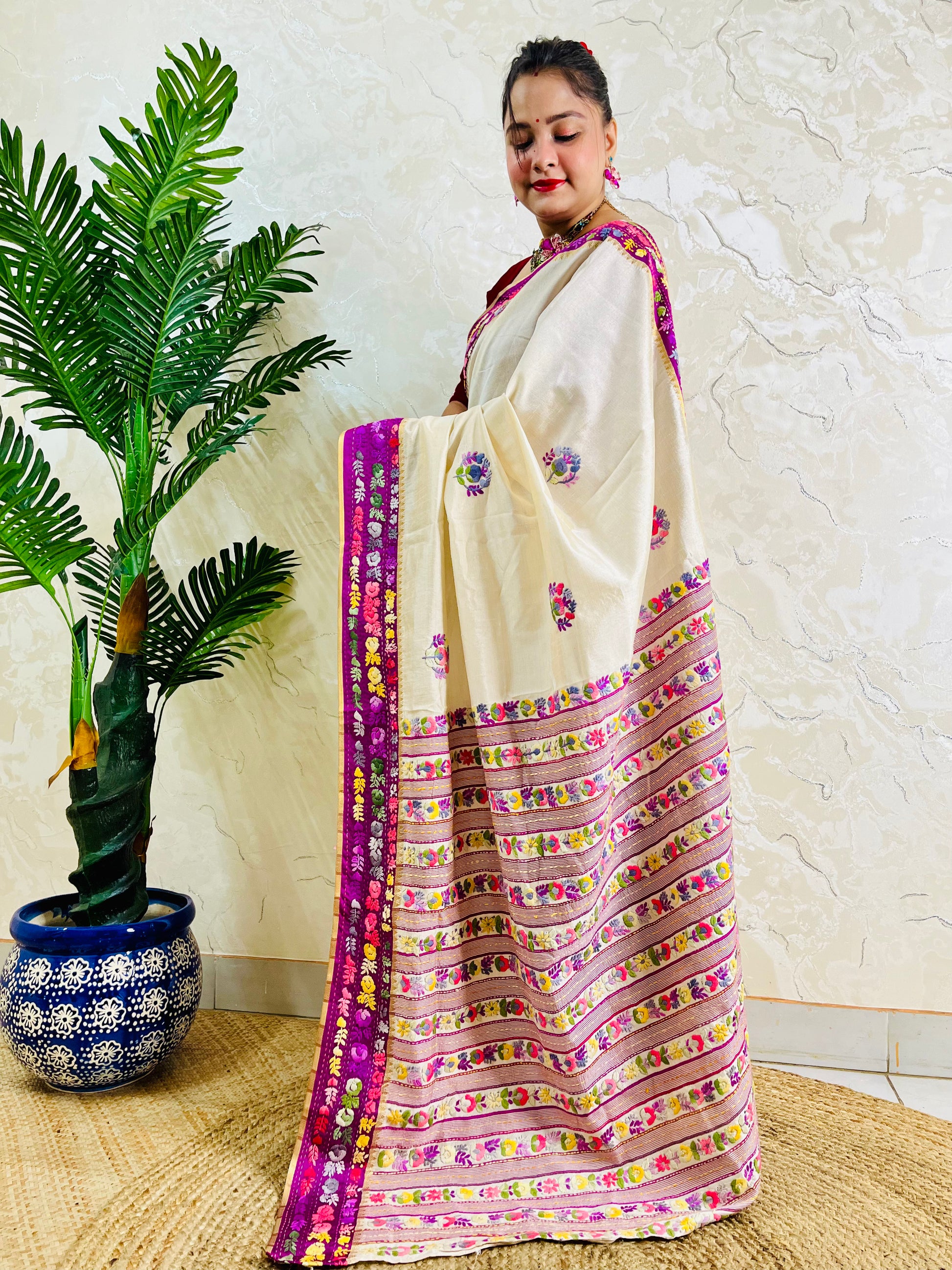 Handwoven Parsi Gara Semi Muga Silk saree with scattered butti florals and deep magenta pink velvet Kardana embroidered border — side standing view, Desi Aadat