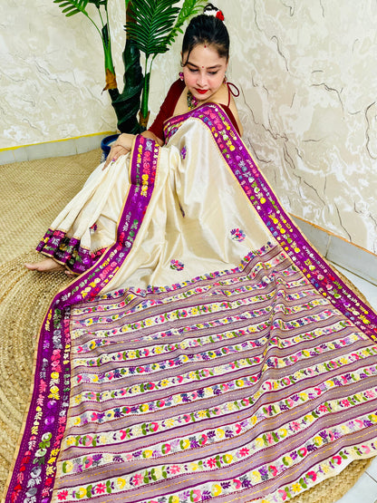 Top sitting view of Parsi Gara Semi Muga Silk saree with dense horizontal multicolour floral garden stripes pallu and magenta pink velvet Kardana border — Desi Aadat