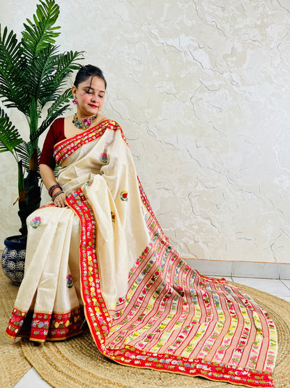 Front standing view of Parsi Gara handwoven Semi Muga Silk saree with red velvet border and multicolour floral embroidery — heirloom saree by Desi Aadat