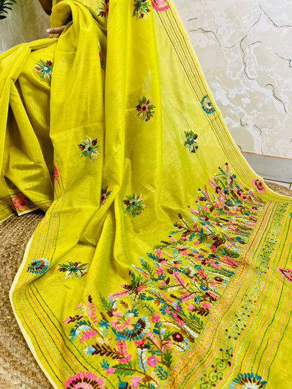 Close-up of handstitched Parsi Gara multicolour floral and daisy medallion embroidery on lemon yellow Chanderi silk cotton saree border — Desi Aadat