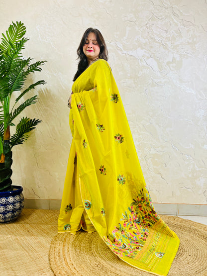 Lemon yellow Parsi Gara handwork Chanderi silk cotton saree with scattered butti florals and multicolour garden border — standing front view, Desi Aadat